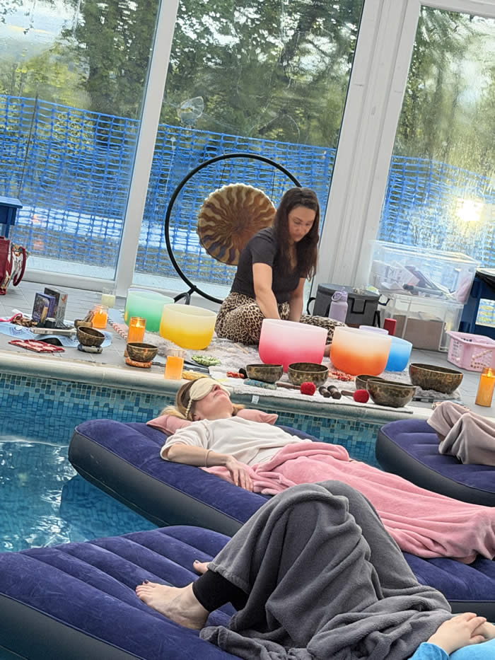 people floating on inflatable beds in swimming pool