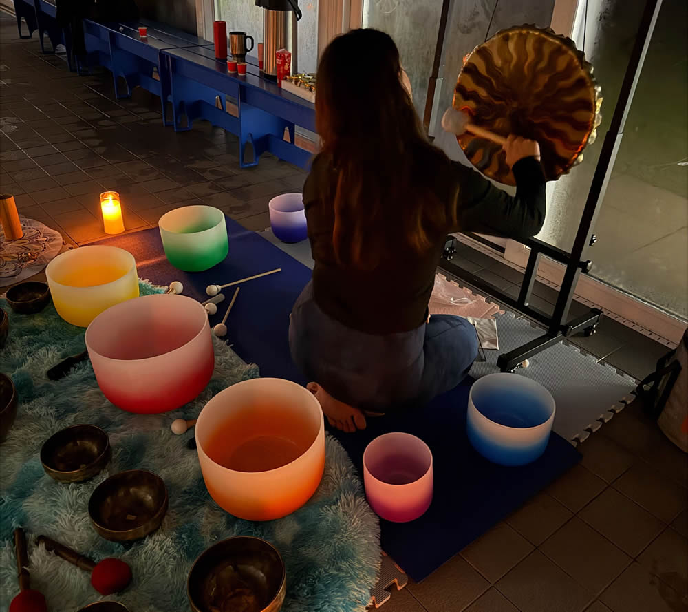 Sound bath session - ladying hitting gong
